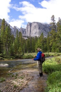 Fly fishing a mountain stream under classic Wind River cliffs.