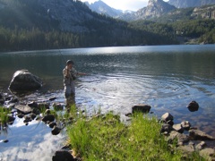 Fly fishing for golden trout in an alpine lake.